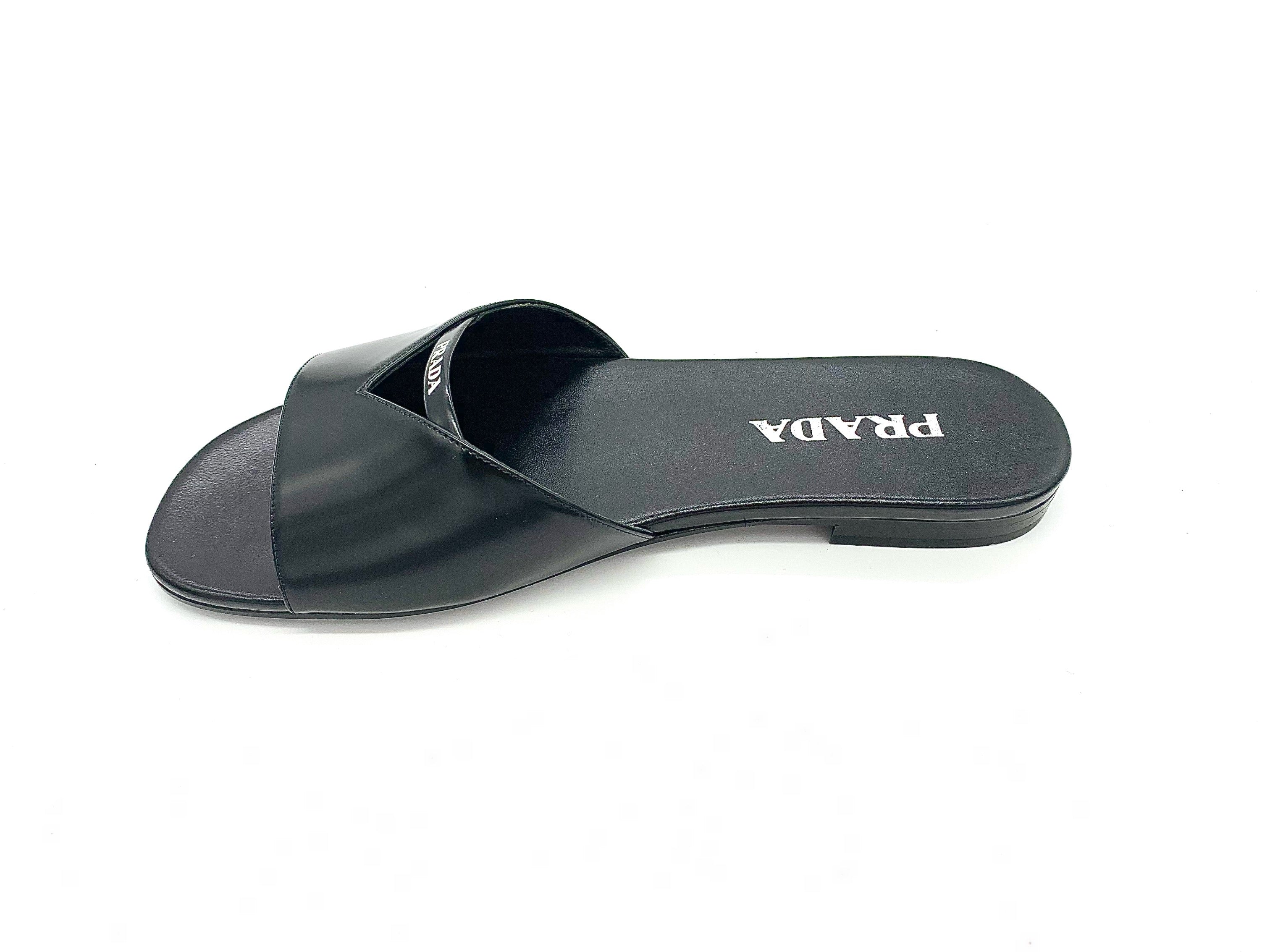 PRADA, PRADA BRUSHED LEATHER CUT OUT SLIDES